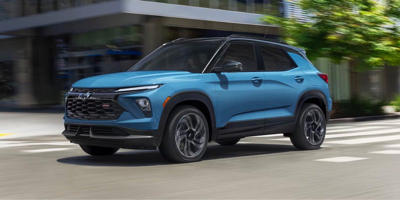 A blue Chevrolet Trailblazer RS driving on a city street.